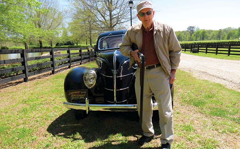 Charlie Mincey with the 1939 Ford Sedan and Ruger Red Label at the Foxhall Resort & Sporting Club