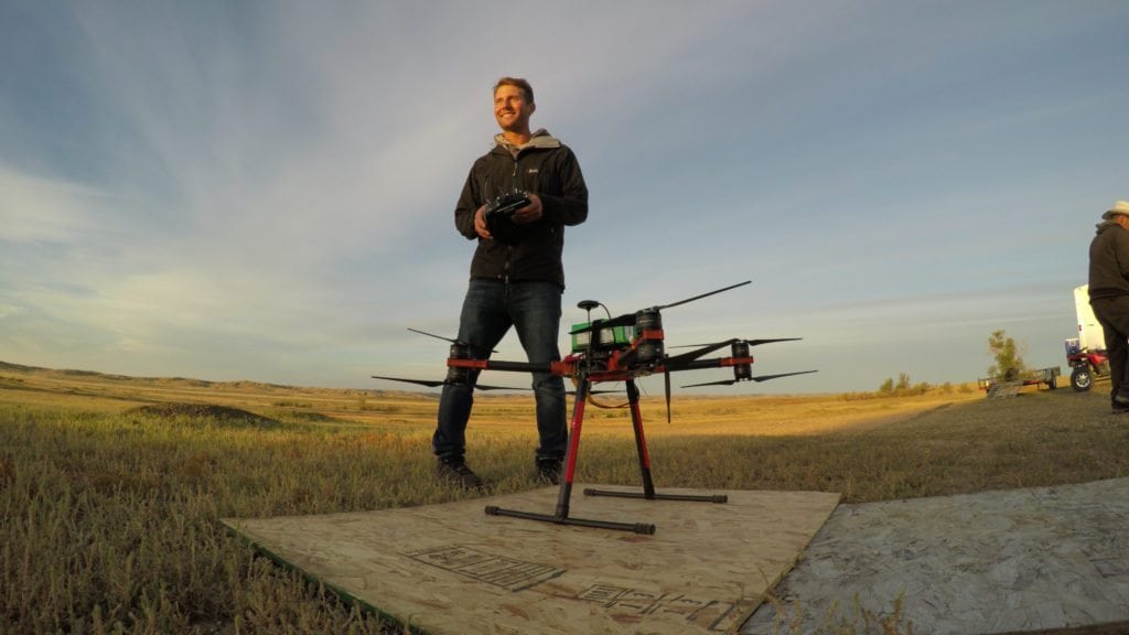 Pilot Jonas Marcinko prepares to launch the drone. (WWF/Conservation Media)