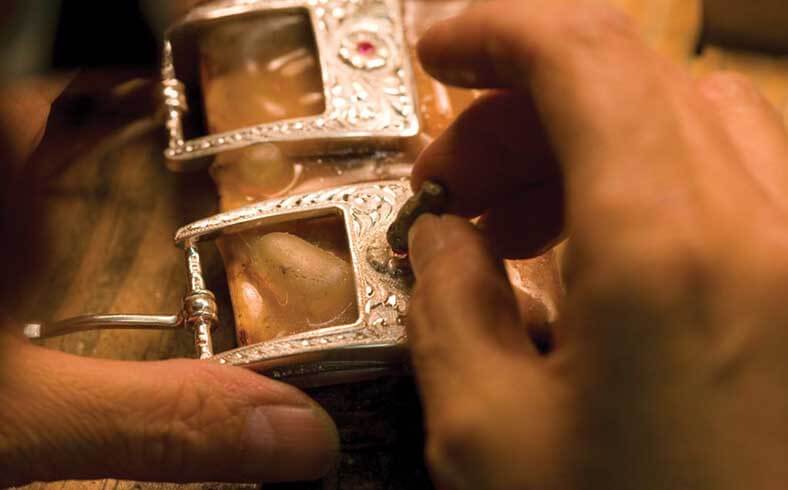 Close-up of silversmith Clint Orms at work