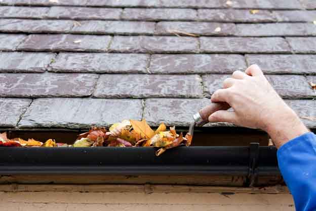 image of clearing gutters