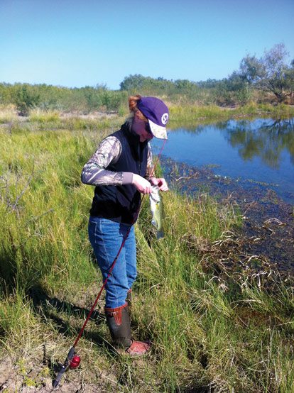 Sarah Nunley Biedenharn holding a fish she caught