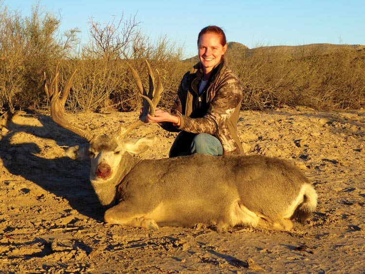 Sarah with a deer she shot