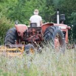 image of farmer on tractor in field