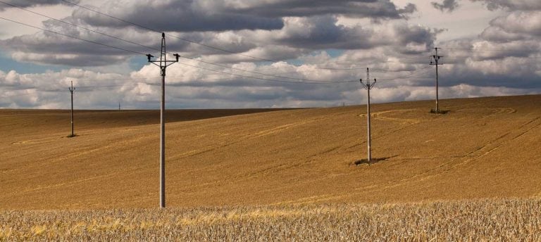 How to Install Power on Vacant Land: Image of power transmission lines in field