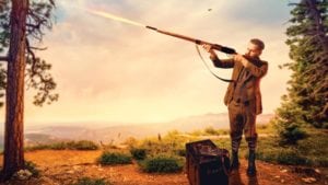 image of man firing shotgun