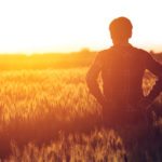 image of farmer standing in field