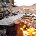 image of fisherman and campfire cooking