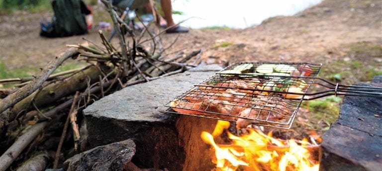 image of fisherman and campfire cooking