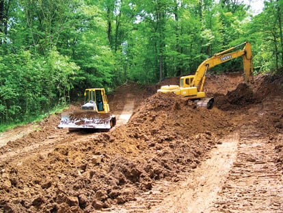 Excavators on land in the Mississippi Delta