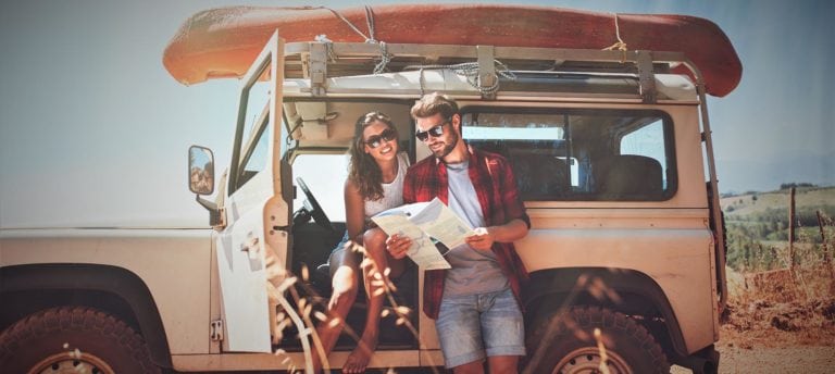 image of adventure travelers with Jeep