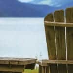 image of Adirondack chair by lake