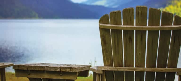 image of Adirondack chair by lake