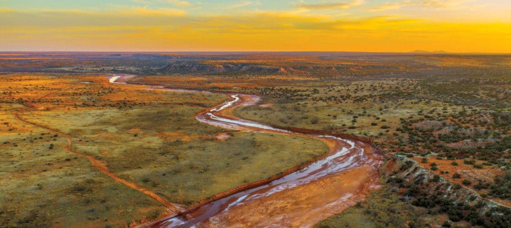 Aerial vista of a property at sunrise