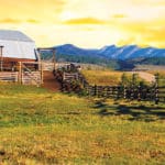 Western Heritage Consulting & Engineering; barn and fencing in front of mountains at sunset